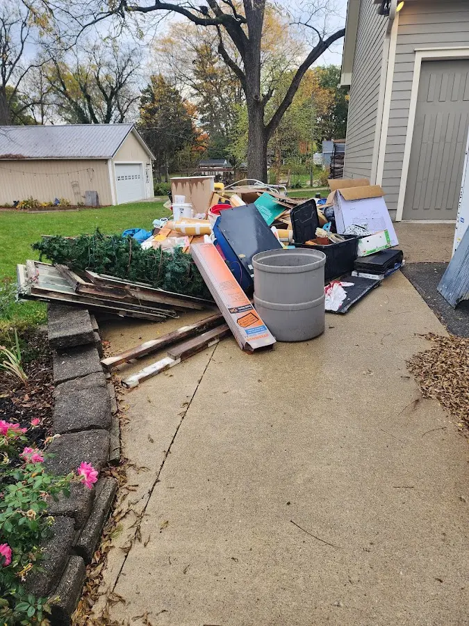 Dumpster being loaded with debris for 30 Yard Dumpster Rental in Goose Creek Village